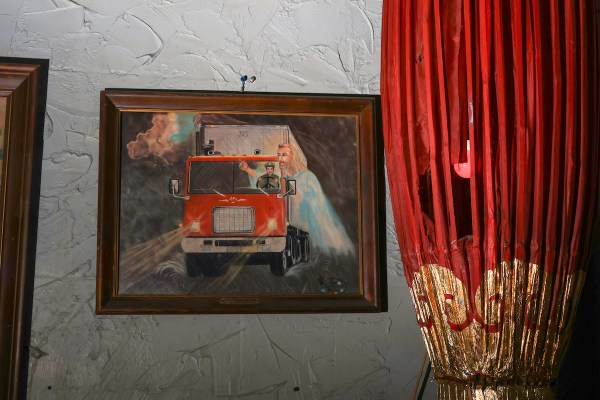Manhattan Cafe in Athens prominently displays a unique piece of vintage Highwaymen art — Rough Draft Atlanta